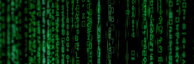 Imagen de stock de letras verdes cayendo sobre fondo negro como en la película Matrix.